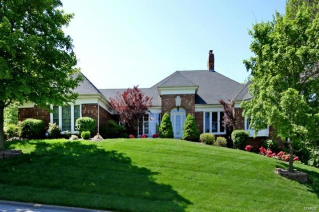 Stately ranch on premier street with extensive lan