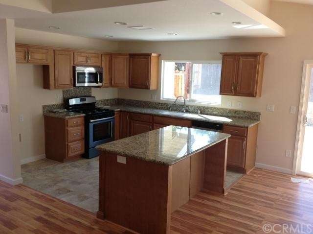 Remodeled kitchen including new appliances and gra