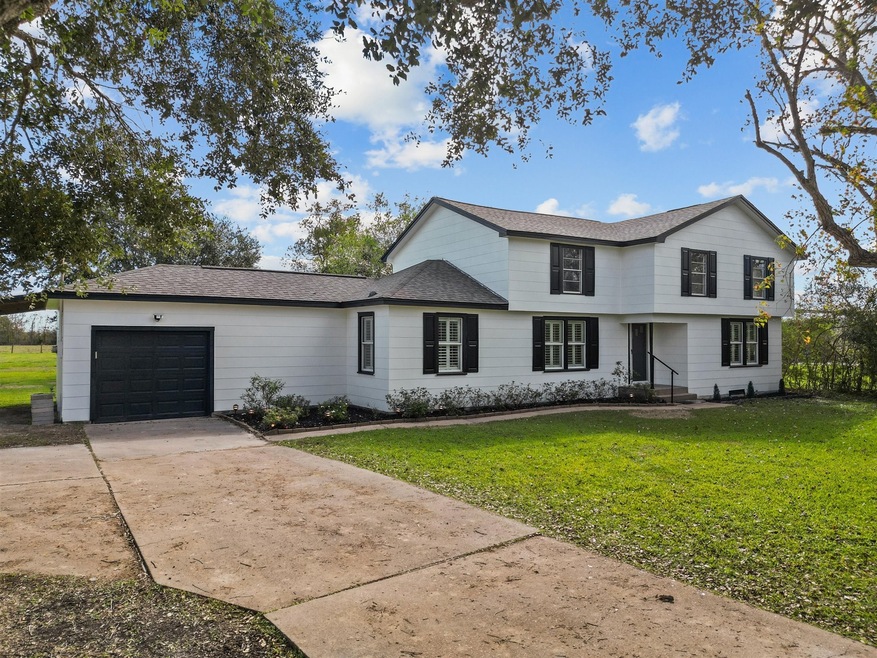 4 beds/2.5 baths & tons of garage space