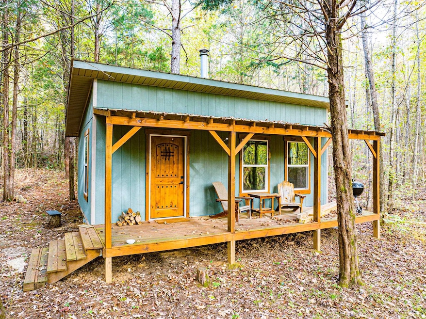 View of outdoor structure featuring a view of trees