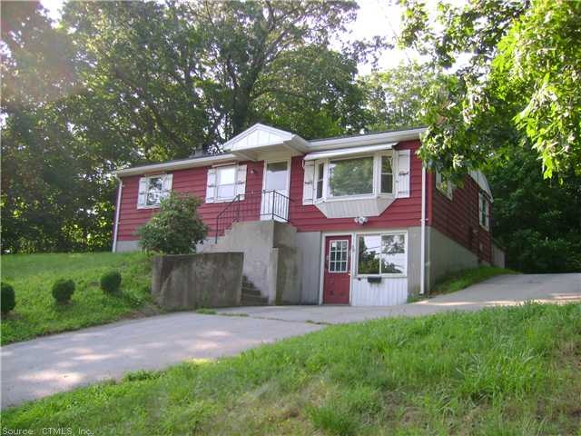 Exterior Front. Sitting pretty up on a hill.