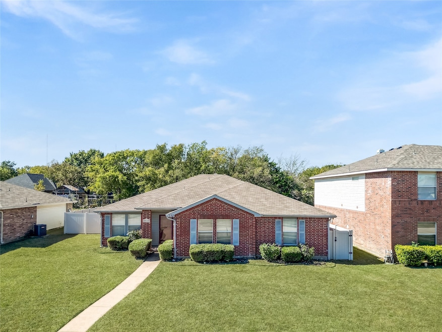 Ranch-style house with brick siding and a shingled roof