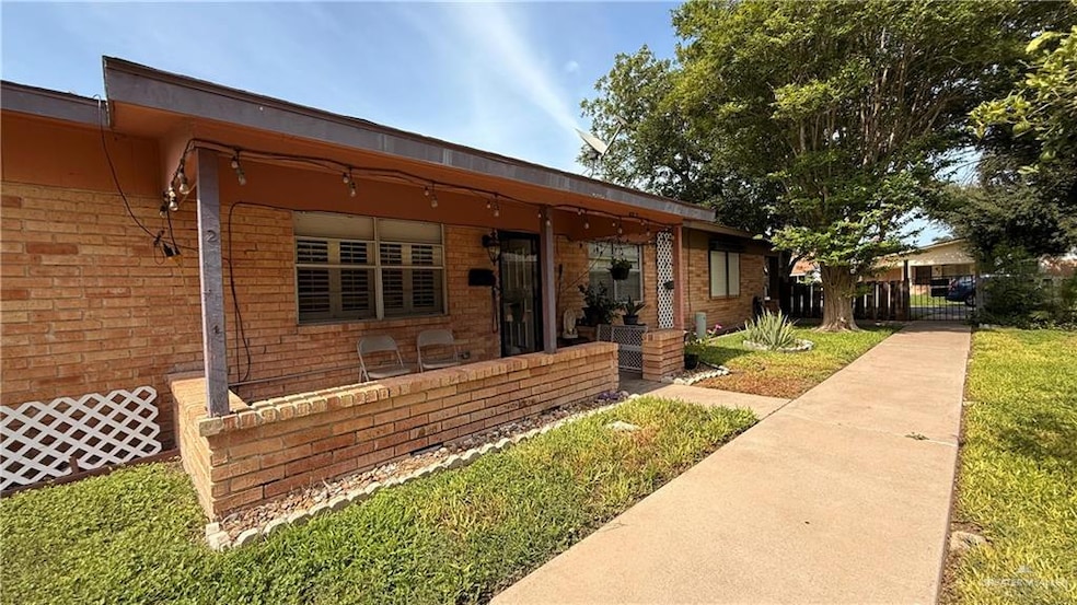 View of front of house featuring brick siding