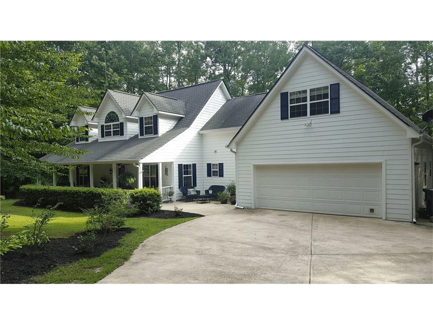 Lovely home on private .9 acre lot with long drive