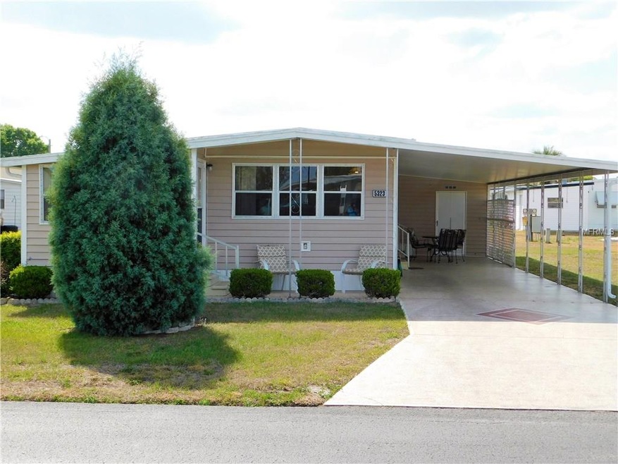 Front of home with painted driveway.