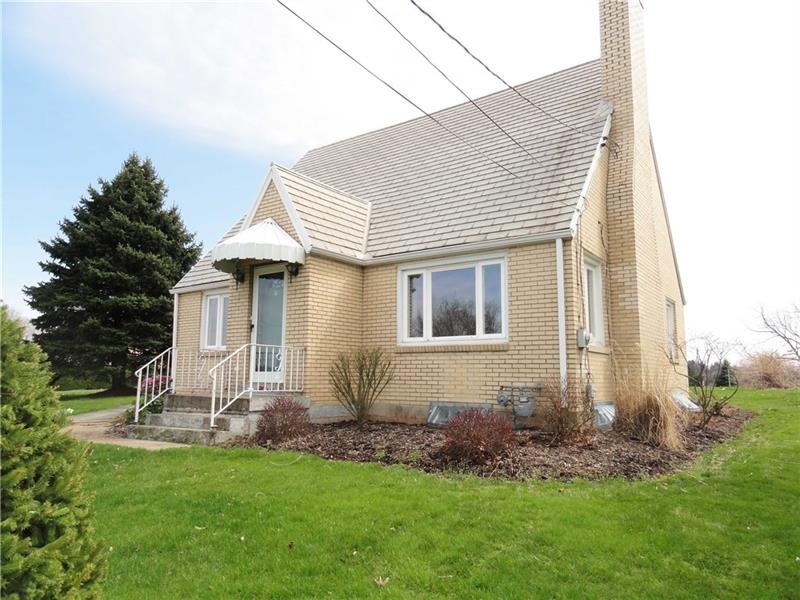 Brick Cape Cod on one acre!