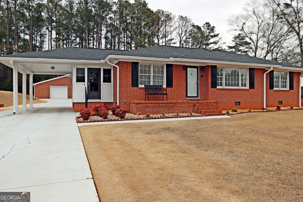 4 Side Brick Ranch, Carport and 3 car Detached gar