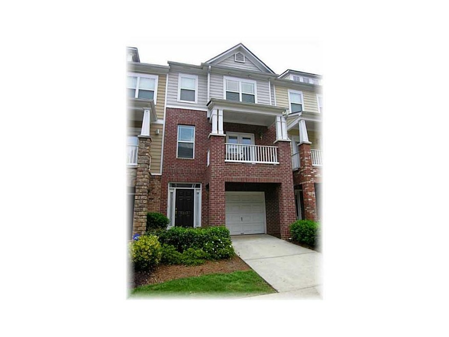 Exterior Front. Brick and Hardi Plank townhome on 