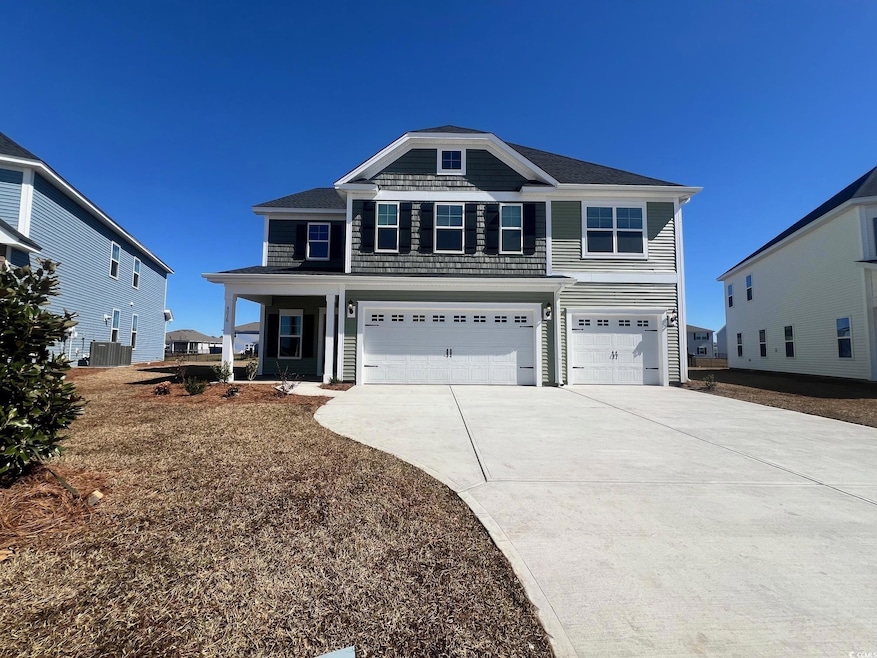 View of front facade featuring an attached garage,