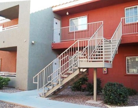 View of property with stairway