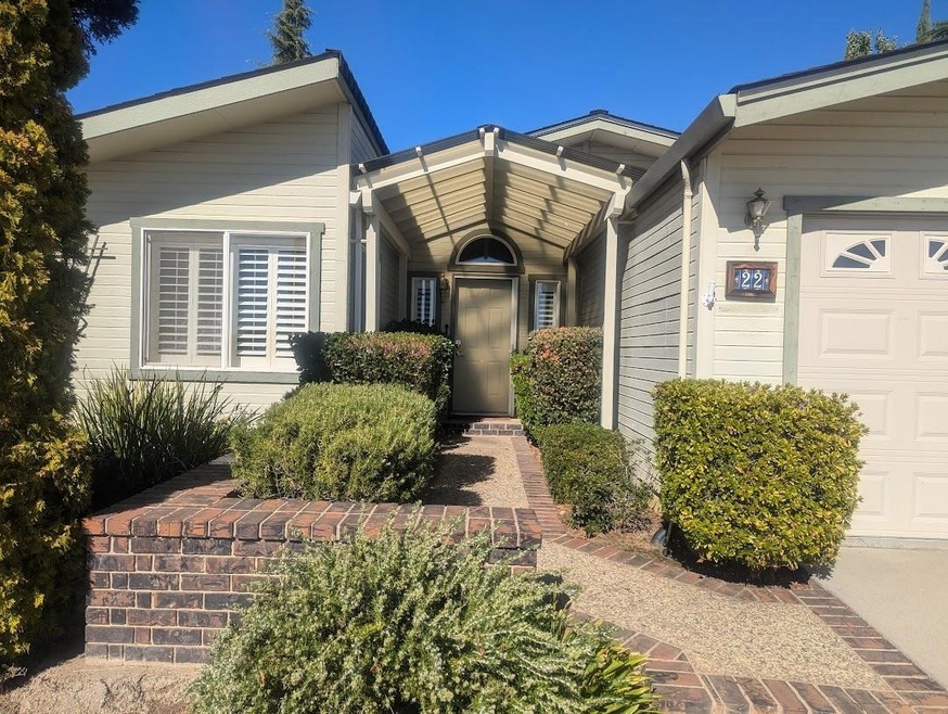 View of exterior entry with a garage