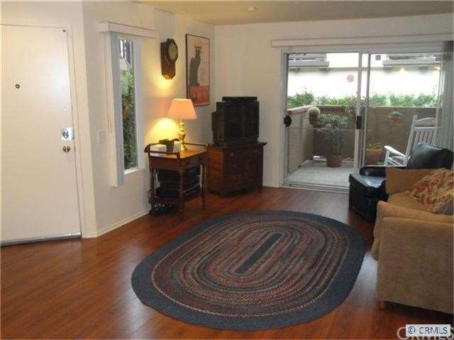 Spacious living room leads out to patio