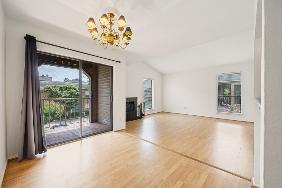 This spacious living area features light wood floo