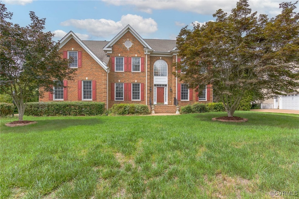 View of front facade featuring brick siding and a