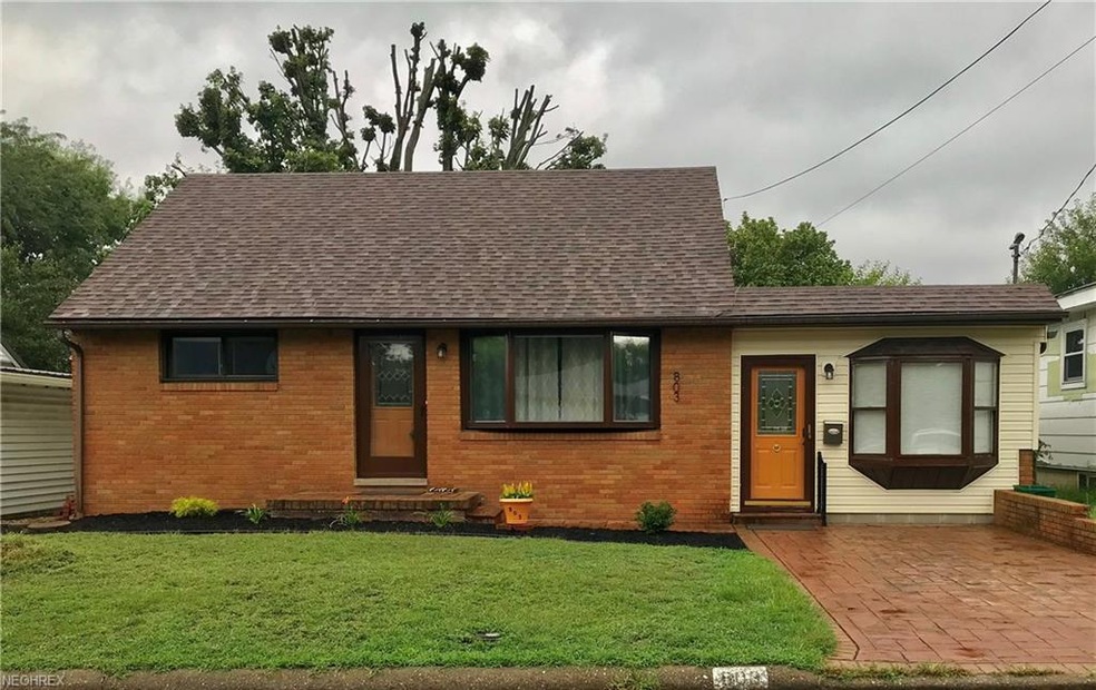 Front of home with new exterior lighting, both ext