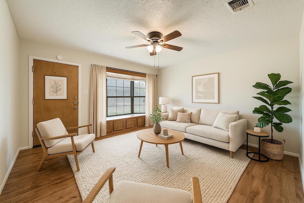 Living area featuring light wood-style floors, a 