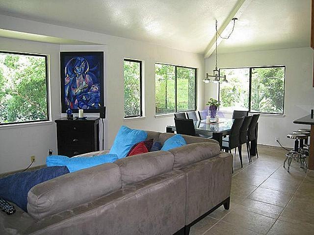 Living and dining area with vaulted ceilings