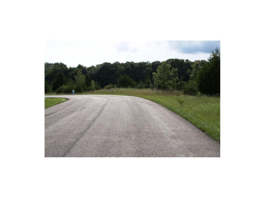 7.79 acre lot with paved street