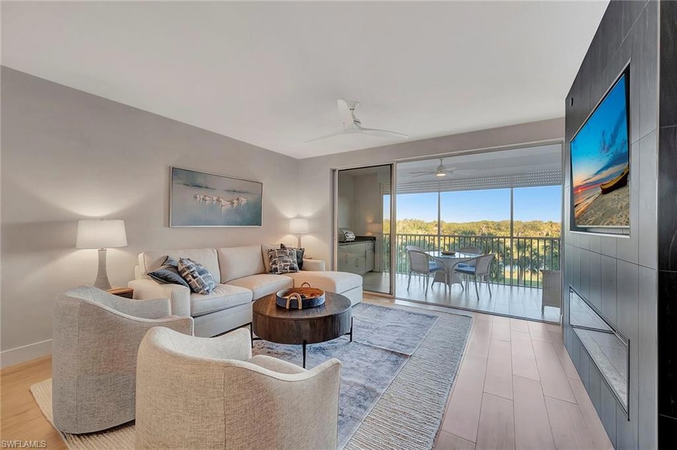 7671 Pebble Creek Cir unit 303, Naples, FL 34108 - photo 1