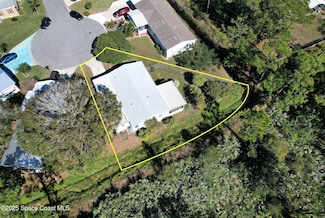 208 Calico Ct, Barefoot Bay, FL 32976