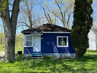 1192 S Belsay Rd, Burton, MI 48509