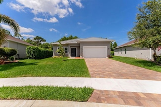 675 NE Moss Rose Place, Port St. Lucie, FL 34983