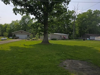 6876 Rowley Dr, Osseo, MI 49266