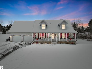 9288 Windsong Ln, Cadillac, MI 49601