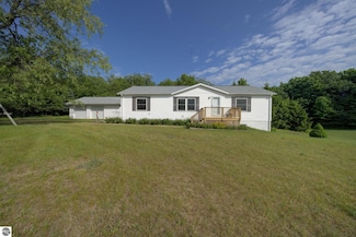 7060 Strawberry Ln, Elmira, MI 49730