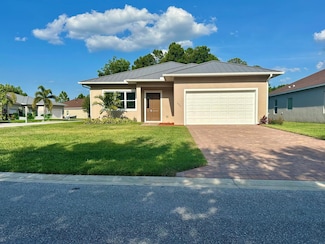 660 NE Moss Rose Place, Port St. Lucie, FL 34983
