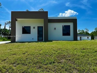 323 Mangonia Ave, Lehigh Acres, FL 33974