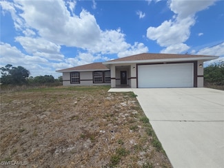 741 Alamo St E, Lehigh Acres, FL 33974