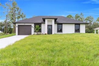 457 Woodman Dr, Lehigh Acres, FL 33972