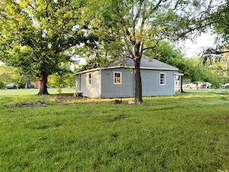 205 1st St, Pecan Gap, TX 75469