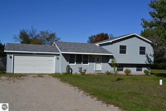 7938 Lois Ave, Grawn, MI 49637
