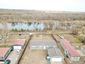 220 Crest Dr, Log Lane Village, CO 80705