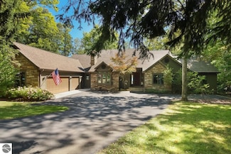 225 N West Torch Lake Dr, Kewadin, MI 49648