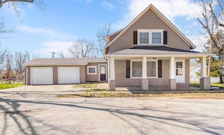 310 W Spruce St, Raymore, MO 64083