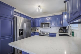 1103 Camelot Dr, Raymore, MO 64083