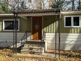 7115 Clinton Ave, Carp Lake, MI 49718