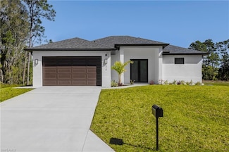 615 Addison St E, Lehigh Acres, FL 33974
