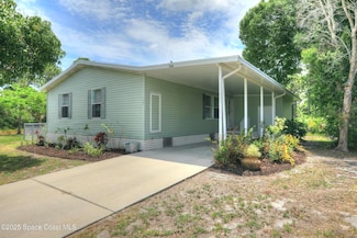 208 Calico Ct, Barefoot Bay, FL 32976