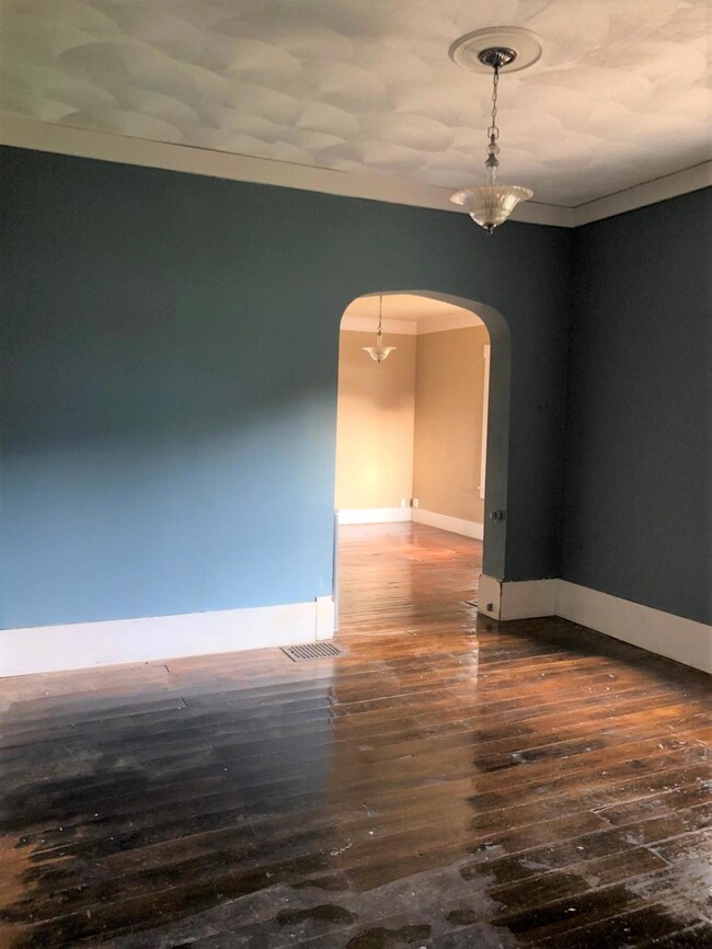 This home has character with tall ceilings, archwa