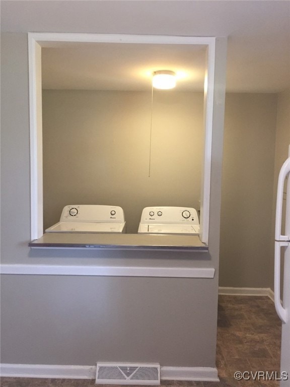 Laundry area featuring washer and clothes dryer an