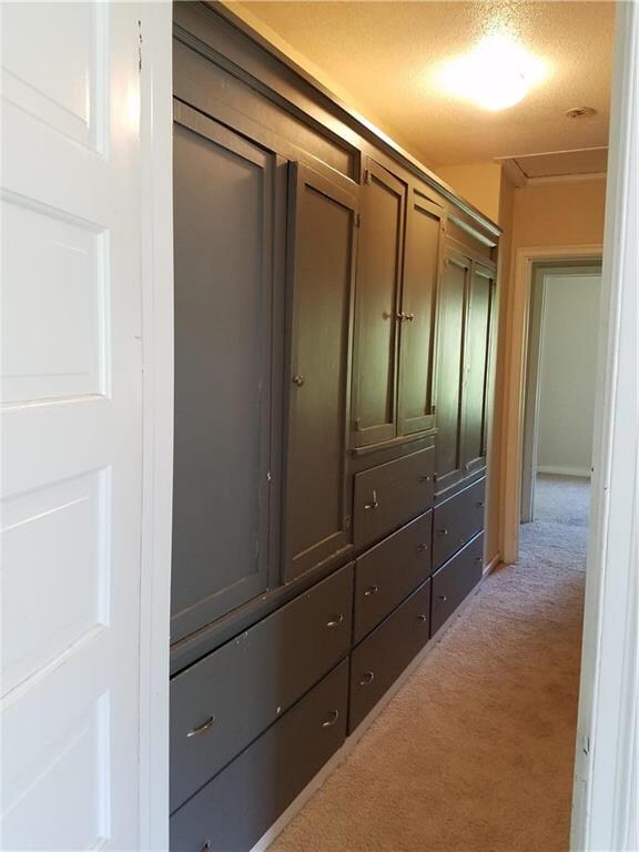 Hallway to bath and 2nd bedroom has lots of built 
