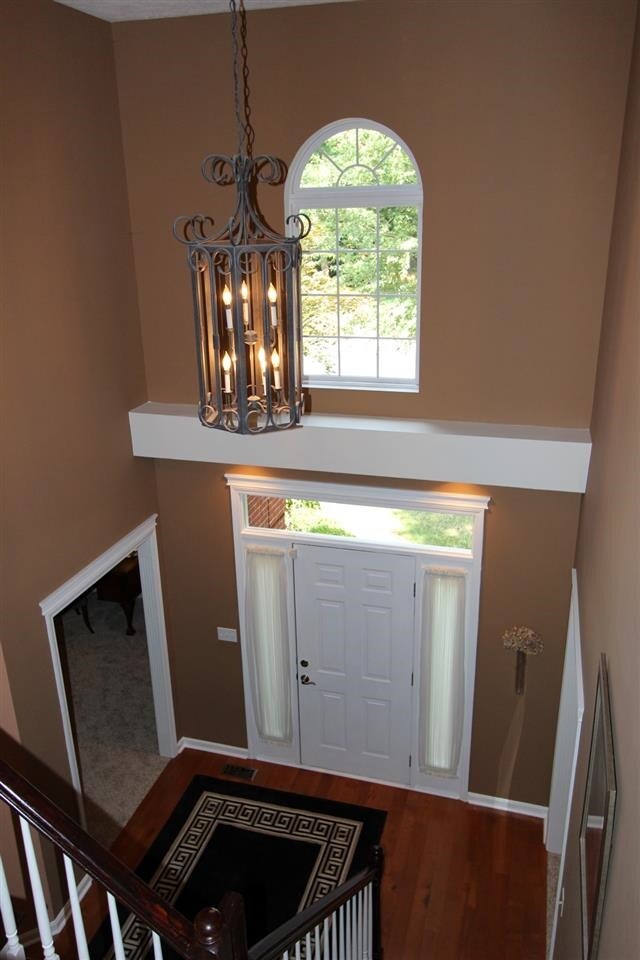 The beautiful 2-story foyer welcomes friends and f