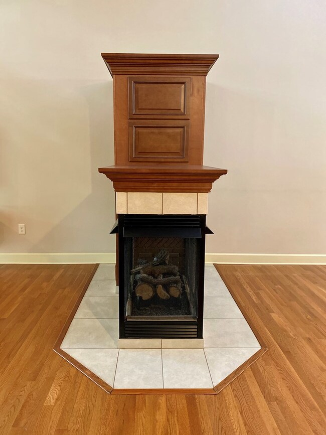 3-sided gas fireplace with shelves room divider