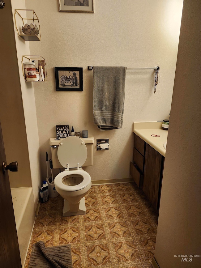 Full bathroom with vanity and a bathtub