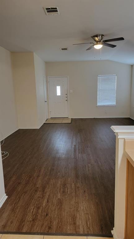 Unfurnished living room with visible vents, dark 