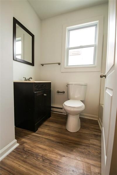 View of the homes full bathroom that has a furnitu